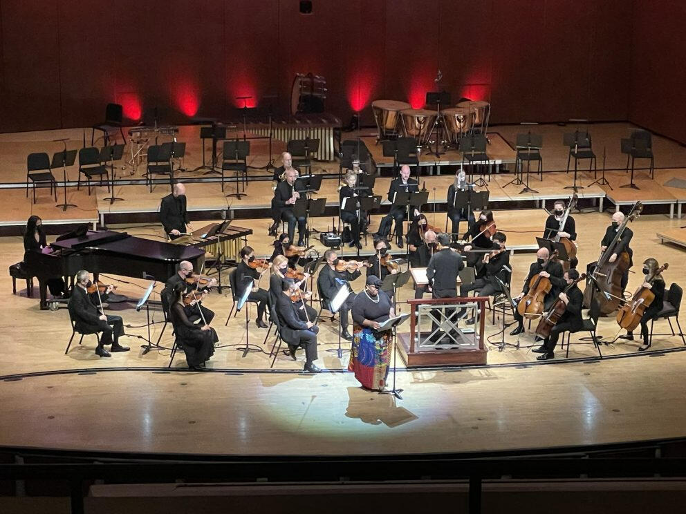 Brittany Green narrates her orchestral work, “Against/Sharp,” on stage with the Atlanta Symphony.
